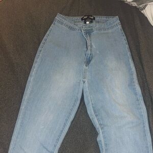 Light-blue flared jeans with a drawstring at the bottom